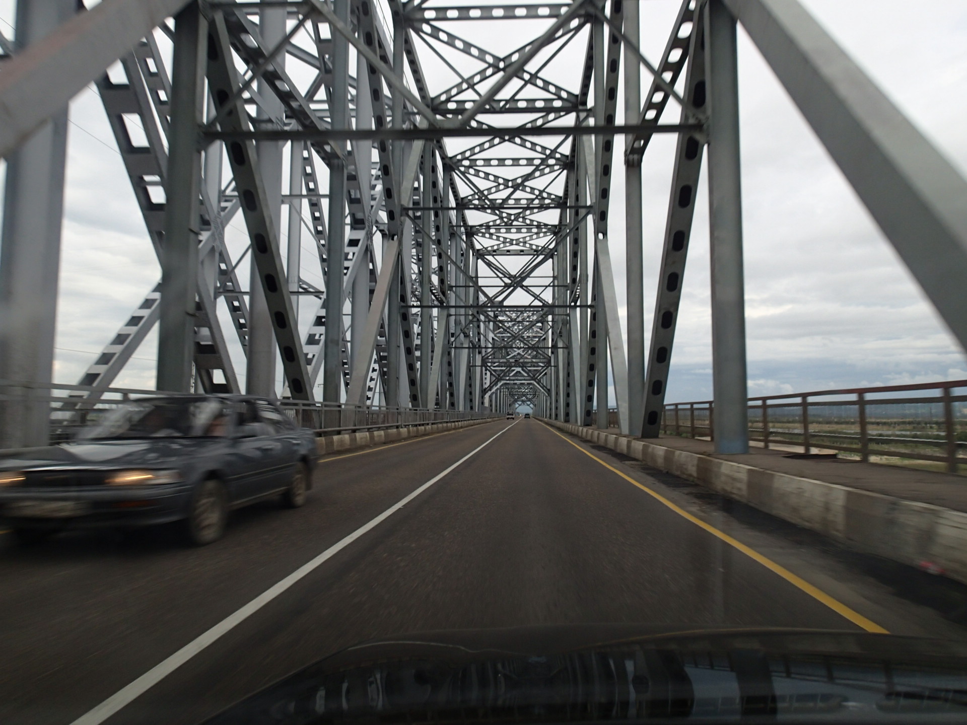 A highway bridge crossing the wide Amur River between Blagoveshchensk in Russia and Heihe in China.
